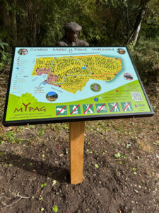 MYPAG Sign with carved man behind (1)